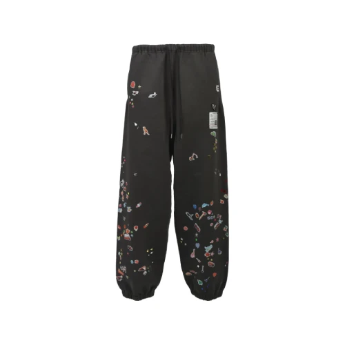 Front view of Maison Mihara Yasuhiro Black Stickers Track Pants with sticker graphic details