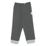 Front view of Maison Mihara Yasuhiro Cuffed Panelled Trousers with structured panel design