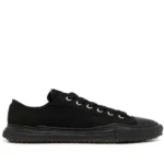 Front perspective of Maison Mihara Yasuhiro Peterson OG Sole Canvas Black Sneaker featuring sculpted rubber sole