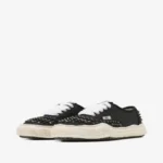 Front view of Maison Mihara Yasuhiro Baker Studded Sneakers