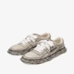 Maison Mihara Yasuhiro Leather Sneakers front view highlighting the toe shape and leather upper.