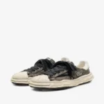 Maison Mihara Yasuhiro Blakey Bleached-Canvas Sneakers front view with distinctive canvas styling.