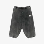 Front view of bleached wide-leg track pants with a relaxed streetwear silhouette
