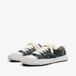 Maison Mihara Yasuhiro Canvas Low-Top Sneakers front view showing the toe and upper design.