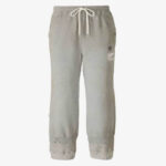 Front view of relaxed trousers featuring a distinctive distressed hem