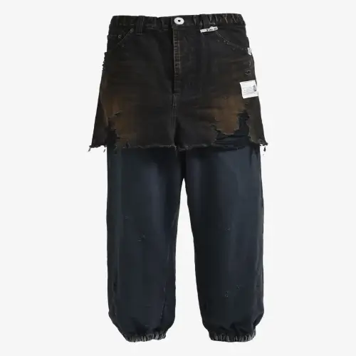 Maison Mihara Yasuhiro Frayed Denim-Panel Jeans (2) Front view of Maison Mihara Yasuhiro Frayed Denim-Panel Jeans highlighting the denim panels and frayed details.