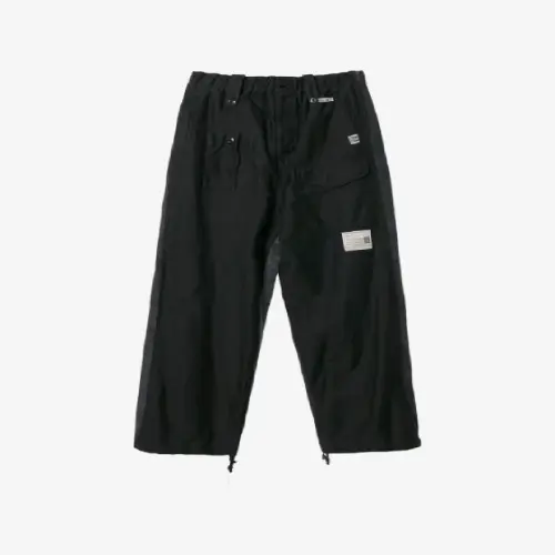 Front view of panelled cargo track trousers with utility-inspired pocket detailing