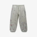 Front view of Maison Mihara Yasuhiro Sticker Printed Sweat Trousers showing the visible graphic details and overall silhouette.