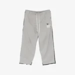 Front view of Maison Mihara Yasuhiro Track Pants Combined Sweat Pants showcasing the distinctive mixed-design construction.