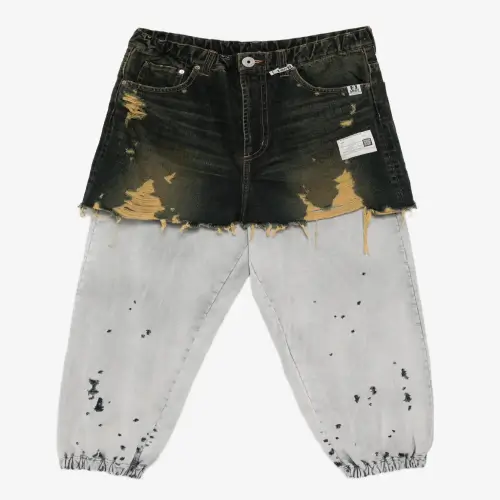Masion Mihara Yasuhiro Distressed Cotton Trouser-Skirt (1) Front view of Maison Mihara Yasuhiro Distressed Cotton Trouser-Skirt showcasing its combined silhouette.